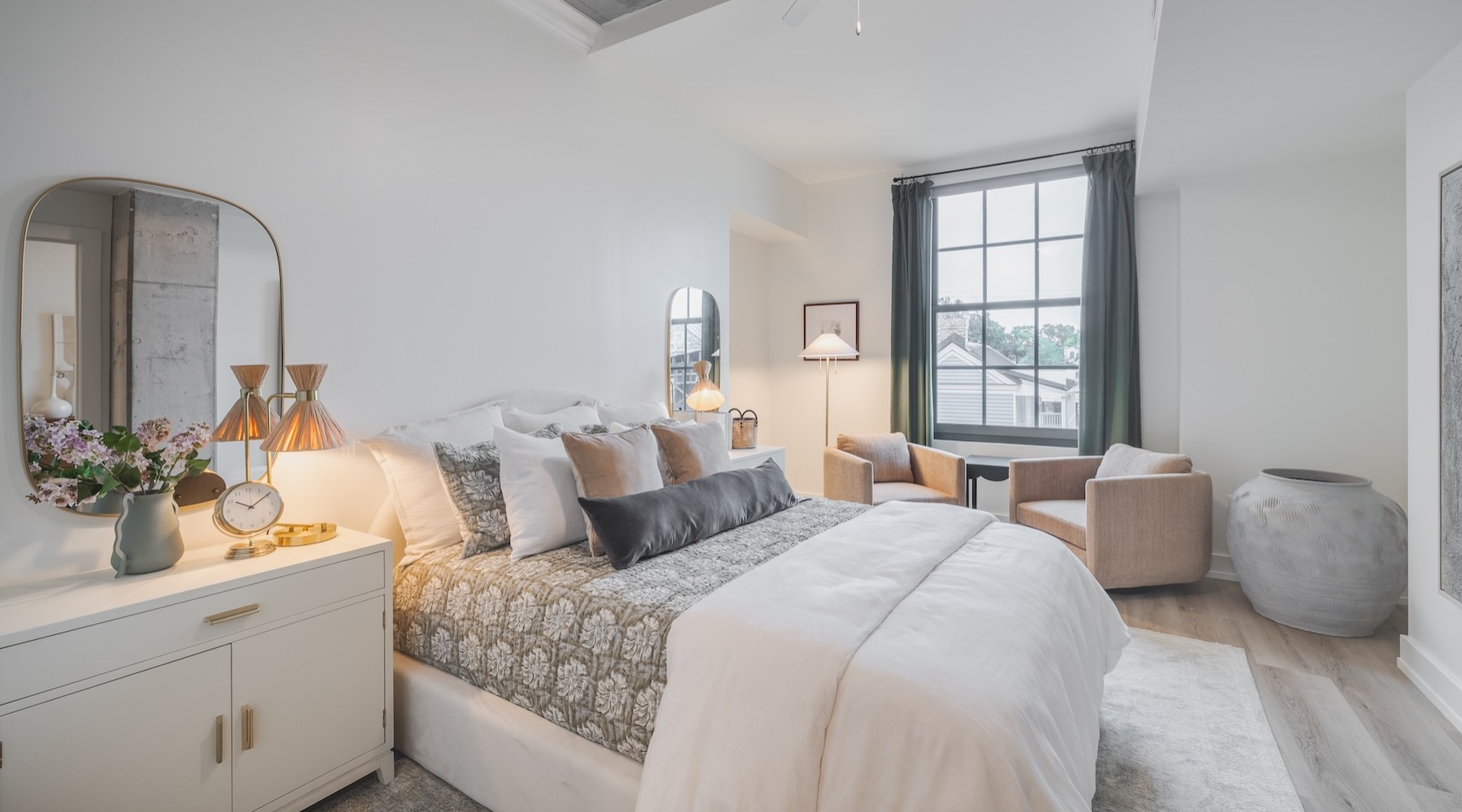 a bedroom with a bed and two nightstands