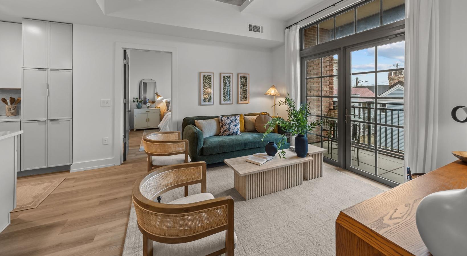 a living room with a couch and chairs